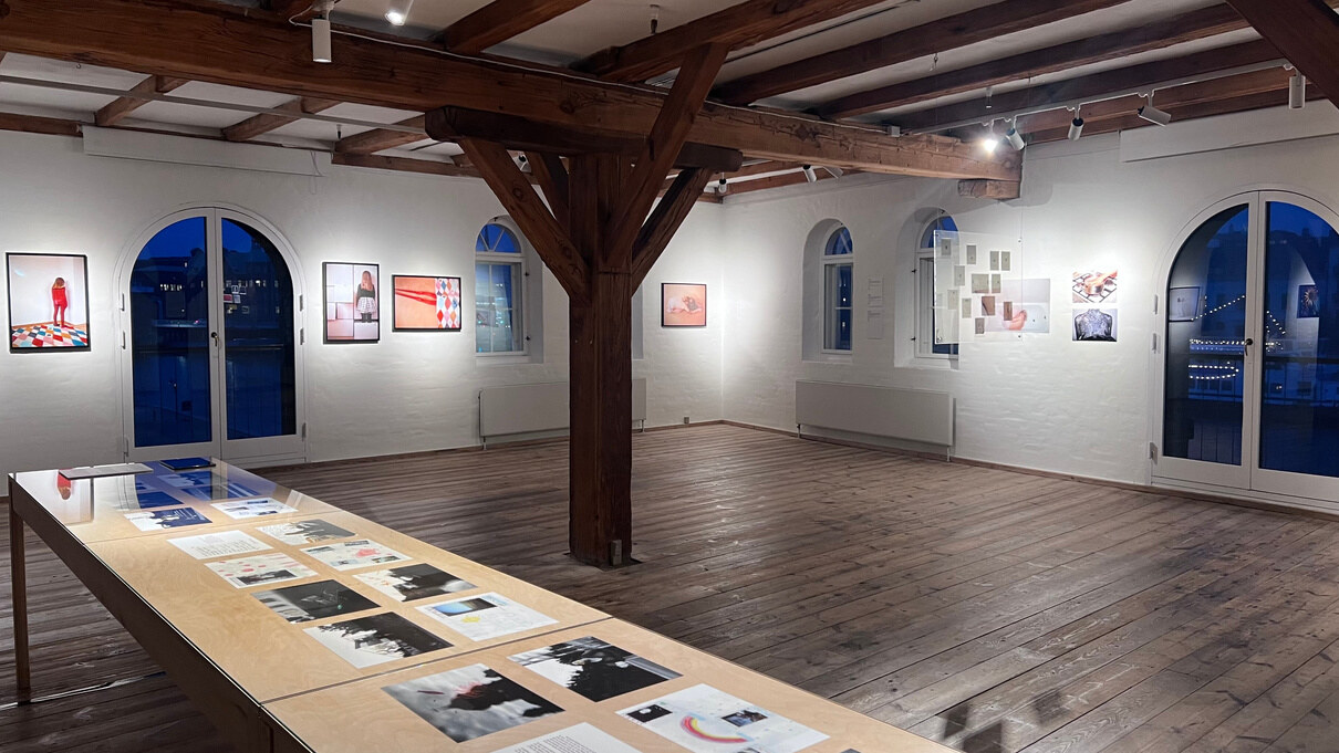 Exhibition hall with works on the walls