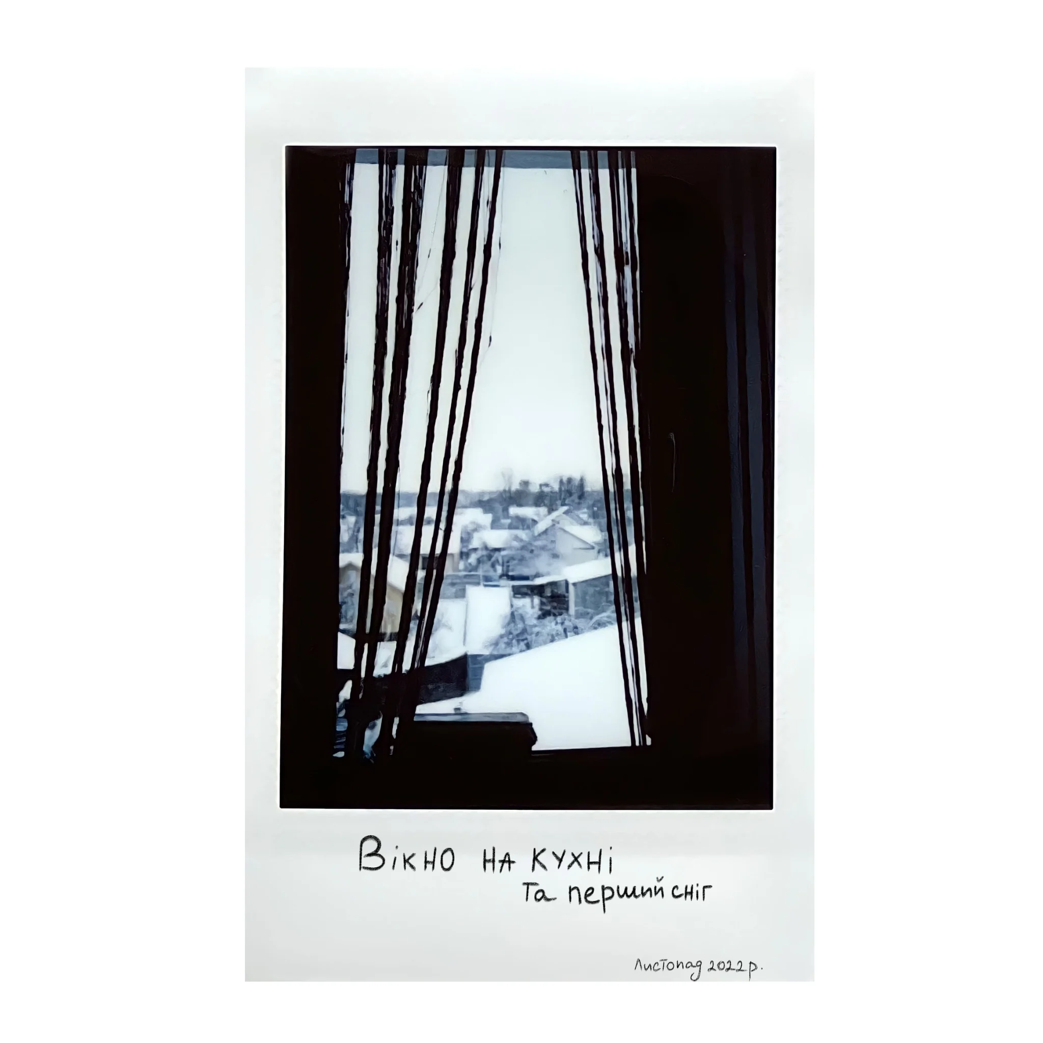 Polaroid of a kitchen window and the first snow