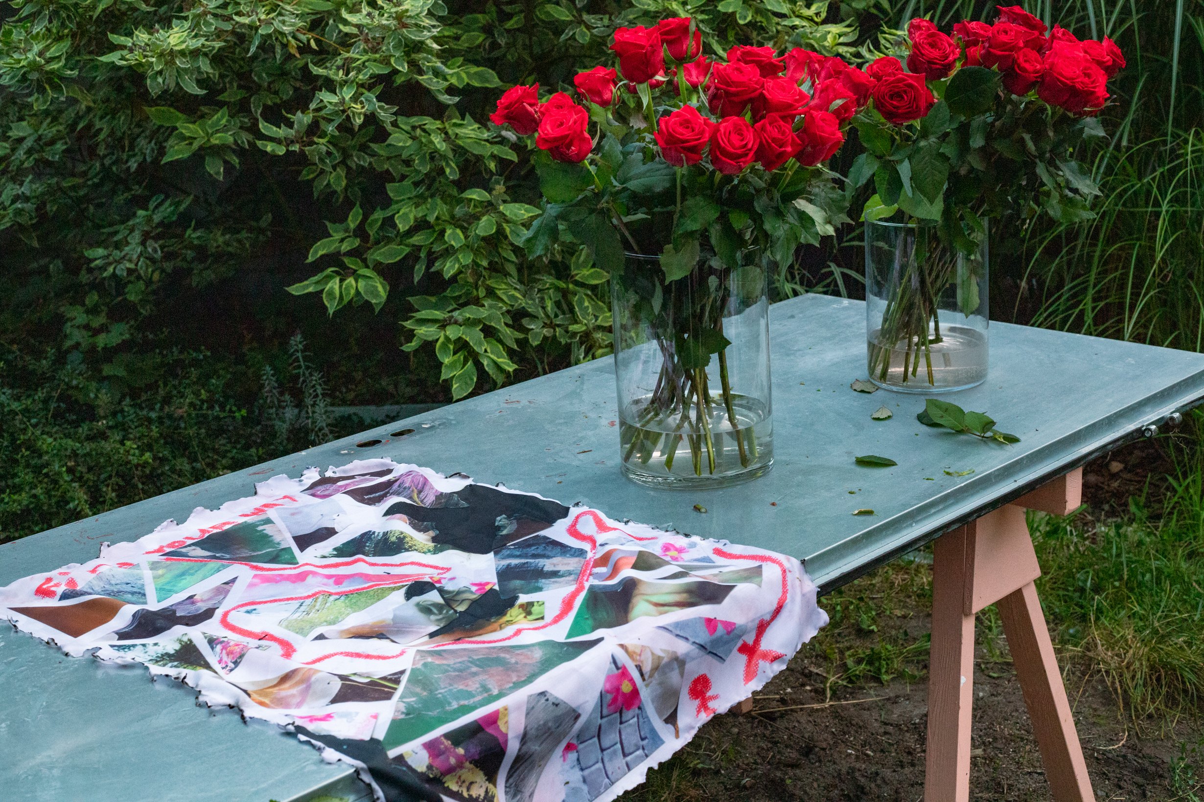 The table after the performance, with roses and a printed cloth