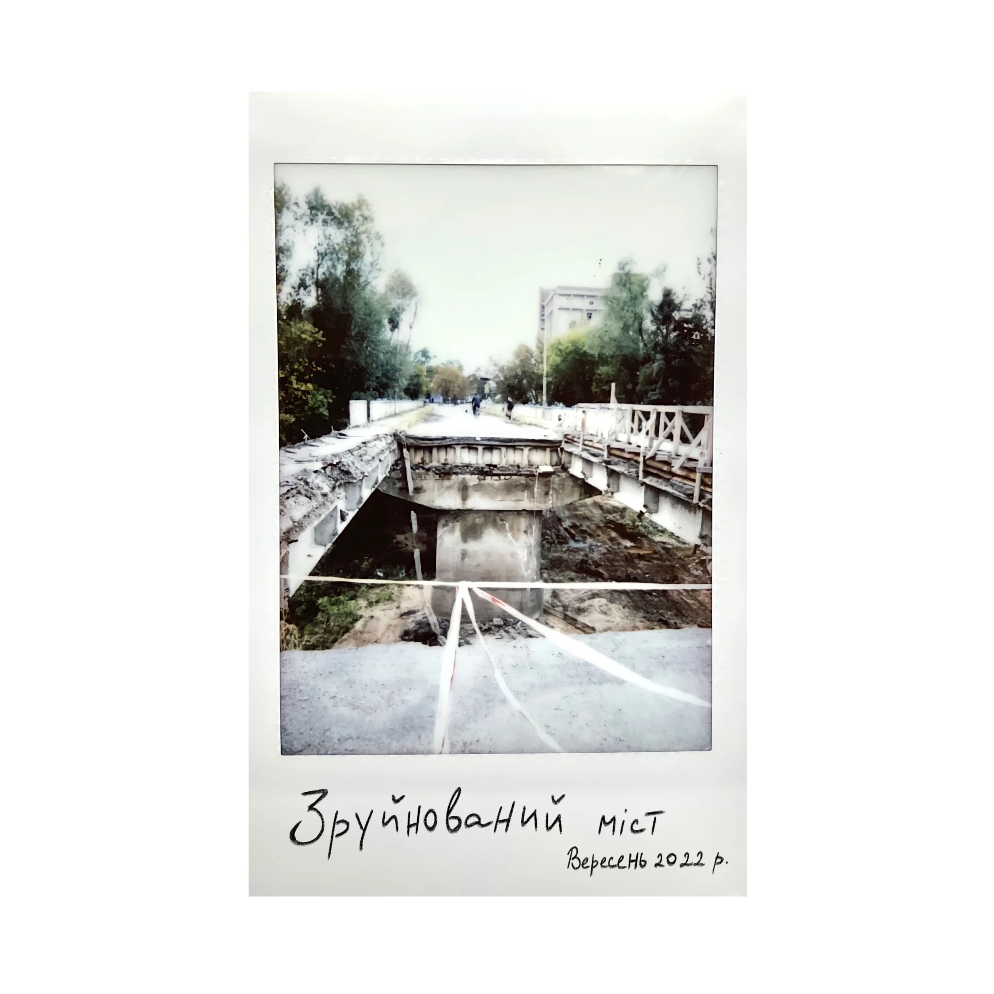 Polaroid of a ruined bridge